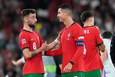 2024–25 UEFA Nations League, Portugal vs Scotland: Cristiano Ronaldo, centre, celebrates with Bruno Fernandes after the match